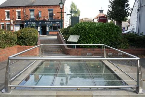 Glass floor viewing panel in Bailgate with pub and phone box Stock Photos