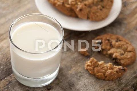 Glass of fresh milk with cookies Stock Photos