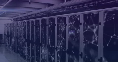 Glass-fronted racks lining data center aisle, with lit servers, cable trays and Stock Photos