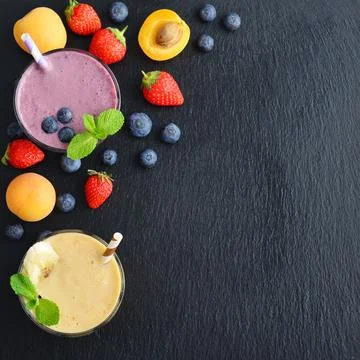 Glass of fruit milkshake Stock Photos