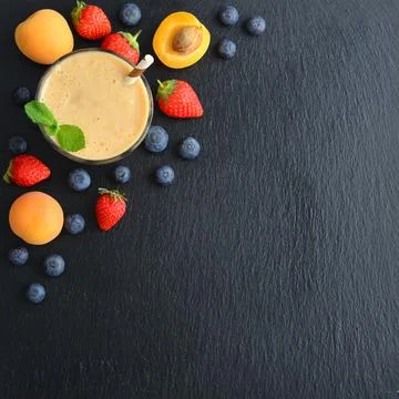 Glass of fruit milkshake Stock Photos