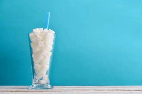 Glass full of sugar cubes Stock Photos