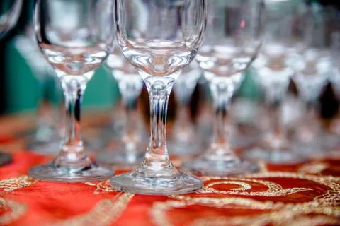 Glass glasses stand on a buffet table Photos