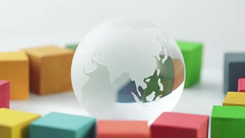 Glass globe and building blocks image Stock Footage 273774582