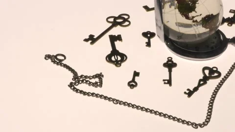 Glass globe and several types of antique keys. Stock Footage 136469782