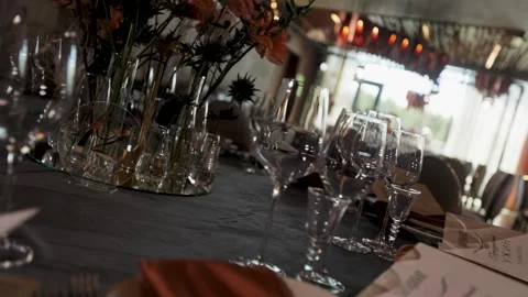 Glass goblets on a restaurant table in a large  Stock Footage 308447543