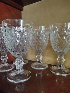 Glass goblets on a shelf Stock Photos