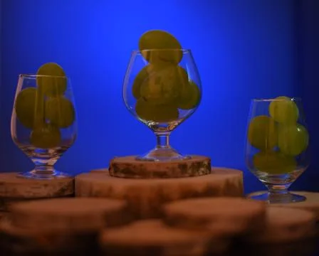Glass with grapes. Stock Photos