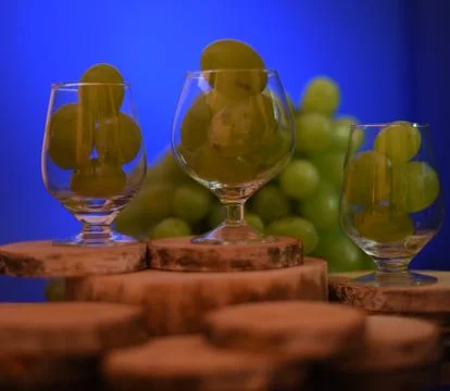 Glass with grapes. Stock Photos