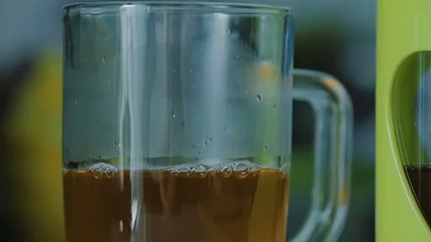 In a glass of green tea, add boiling water. Stock Footage 76988554