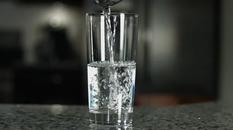 Glass Half Empty or Half Full Pour Stock Footage 60632405