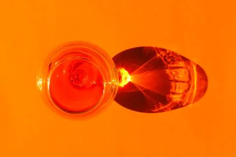 A glass with a hard shadow on a plain background. the view from the top. blank Stock Photos