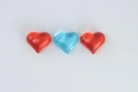 Glass hearts on a withe background. Valentines day. Place for text. Stock Photos