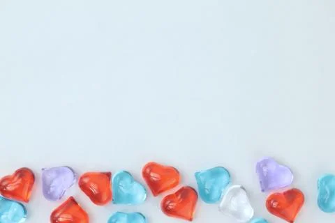 Glass hearts on a withe background. Valentines day. Place for text. Stock Photos
