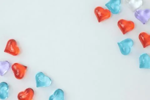 Glass hearts on a withe background. Valentines day. Place for text. Stock Photos