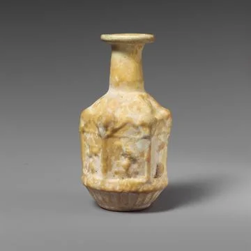 Glass hexagonal bottle ca. A.D. 2550 Roman Opaque white.Rim folded out, rou.. Stock Photos