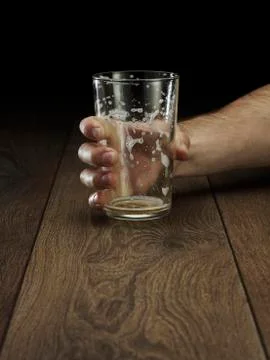 Glass hitting table Stock Photos