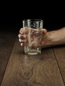 Glass hitting table Stock Photos