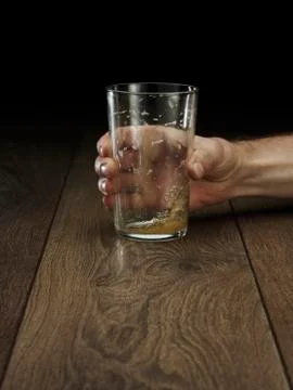 Glass hitting table Stock Photos