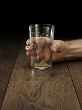 Glass hitting table Stock Photos