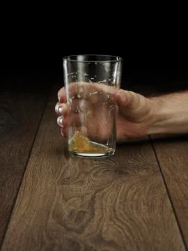 Glass hitting table Stock Photos