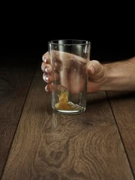 Glass hitting table Stock Photos