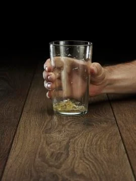 Glass hitting table Stock Photos