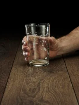 Glass hitting table Stock Photos