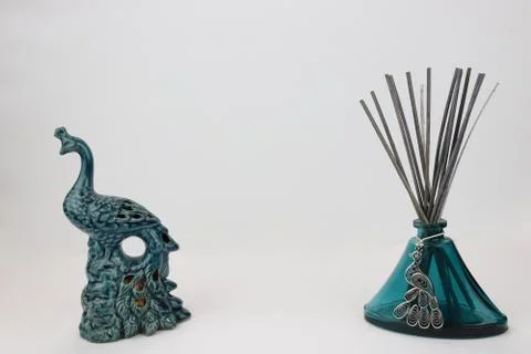 Glass home decor incense diffuser with peacock pendant Stock Photos