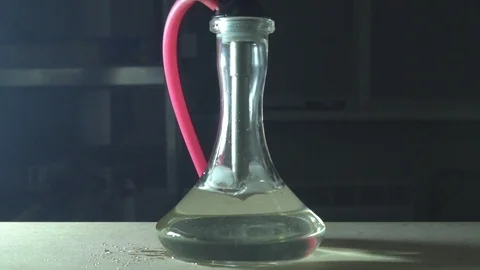 Glass hookah on table on smoke in slow motion Stock Footage 102531639