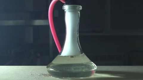 Glass hookah on table on smoke in slow motion Stock Footage 102531777