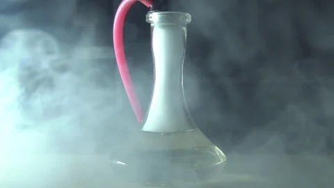 Glass hookah on table on smoke in slow motion Stock Footage 102531868