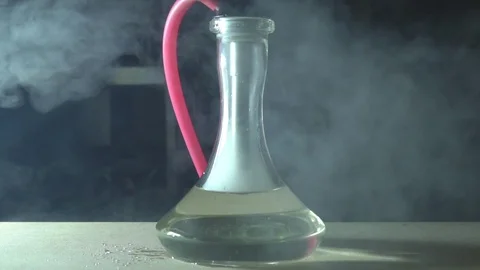 Glass hookah on table on smoke in slow motion Stock Footage 102531946