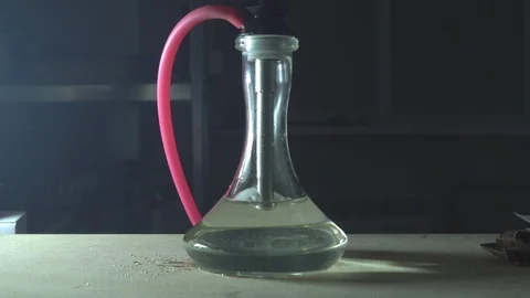 Glass hookah on table on smoke in slow motion Stock Footage 102532068