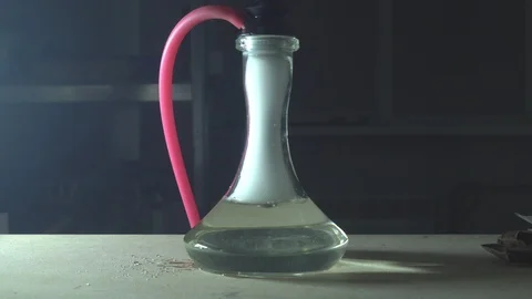 Glass hookah on table on smoke in slow motion Stock Footage 102532231
