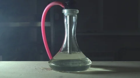 Glass hookah on table on smoke in slow motion Stock Footage 102532343