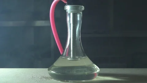 Glass hookah on table on smoke in slow motion Stock Footage 102532484