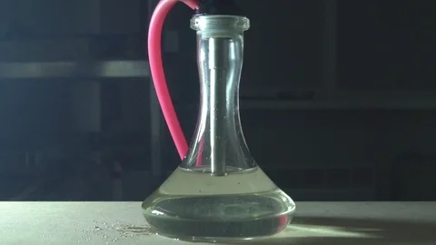Glass hookah on table on smoke in slow motion Stock Footage 102532541