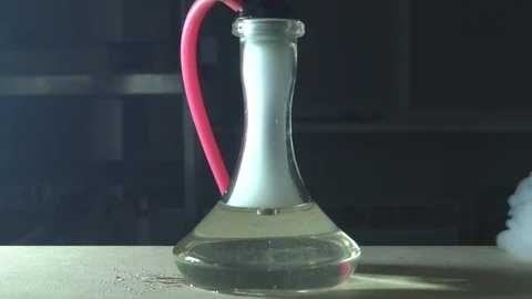 Glass hookah on table on smoke in slow motion Stock Footage 102532580