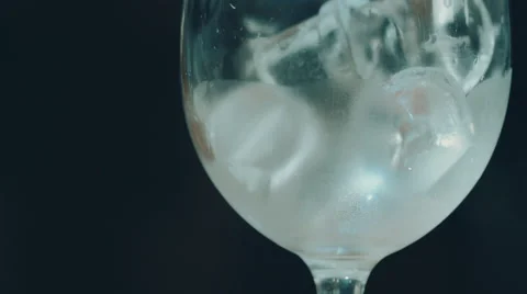 A glass with ice on the black background Stock Footage 52183116