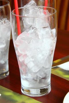 Glass with ice cubes Stock Photos