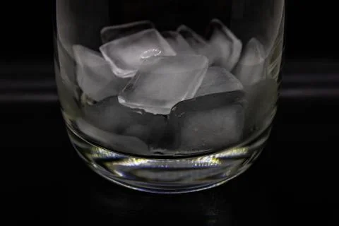 Glass with ice cubes Stock Photos