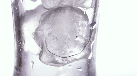 Glass with ice cubes on white background Stock Footage 34311351