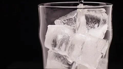Glass with ice filled with ginger ale Stock Footage 134883743