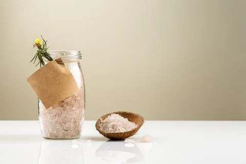 Glass jar with bath salt with empty label on it Stock-Fotos