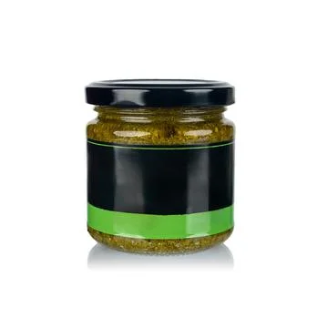 Glass jar with black lid and blank label on white background Stock Photos