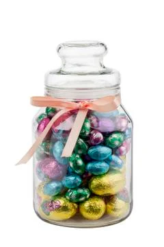 Glass jar with chocolate easter eggs Stock Photos