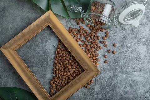 A glass jar of coffee beans with frame Stock Photos