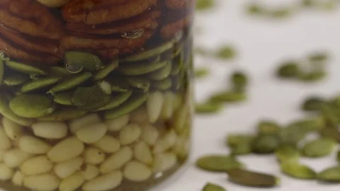 A glass jar filled with a mixture of nuts Stock Footage 124681122