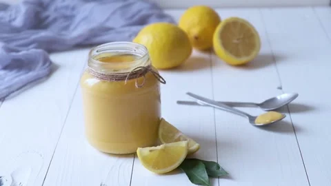  Glass jar with lemon curd on the table Stock Footage 147950976